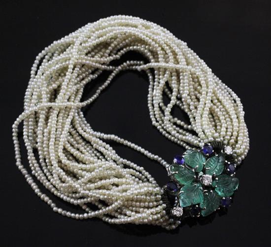 An Italian multi-strand seed pearl bracelet with 18ct white gold, emerald, sapphire and diamond set clasp, approx. 6in.